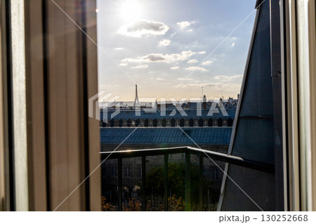 Stunning view from the window of the Eiffel Tower and roofs of houses Stunning view from the window of the Eiffel Tower and roofs of houses 130252668