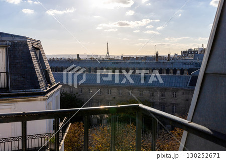 Stunning view from the window of the Eiffel Tower and roofs of houses Stunning view from the window of the Eiffel Tower and roofs of houses 130252671