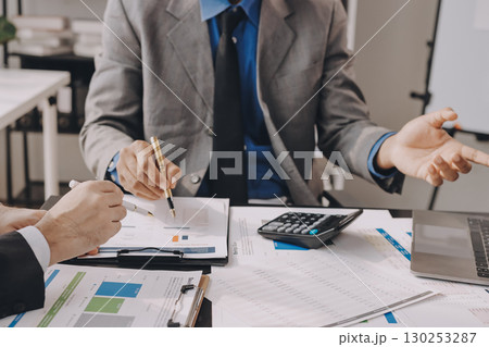 Accounting company provide finance and taxation planning for profitable cash flow, Auditor and accountant team working in office, analyze financial data and accounting record with calculator.Insight 130253287