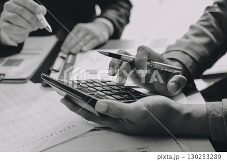 Accounting company provide finance and taxation planning for profitable cash flow, Auditor and accountant team working in office, analyze financial data and accounting record with calculator.Insight Accounting company provide finance and taxation planning for profitable cash flow, Auditor and accountant team working in office, analyze financial data and accounting record with calculator.Insight 130253289