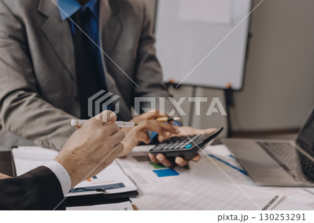 Accounting company provide finance and taxation planning for profitable cash flow, Auditor and accountant team working in office, analyze financial data and accounting record with calculator.Insight Accounting company provide finance and taxation planning for profitable cash flow, Auditor and accountant team working in office, analyze financial data and accounting record with calculator.Insight 130253291