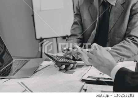 Accounting company provide finance and taxation planning for profitable cash flow, Auditor and accountant team working in office, analyze financial data and accounting record with calculator.Insight 130253292