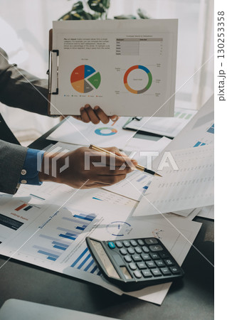 Accounting company provide finance and taxation planning for profitable cash flow, Auditor and accountant team working in office, analyze financial data and accounting record with calculator.Insight Accounting company provide finance and taxation planning for profitable cash flow, Auditor and accountant team working in office, analyze financial data and accounting record with calculator.Insight 130253358