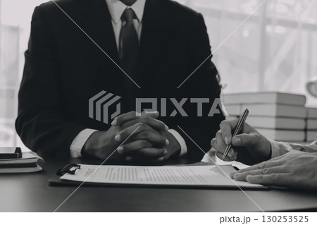 Lawyer explained to the client about the law that must be brought against the court case. 130253525