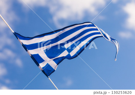 Greek flag waving against blue sky 130253620