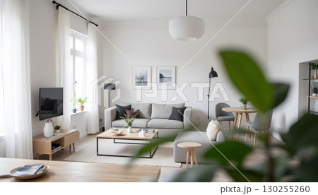 Modern Minimalist Living Room with Bright Natural Light and Elegant Decor Elements 130255260