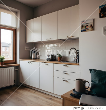 Modern minimalist kitchen interior with natural light and sleek design features 130255312