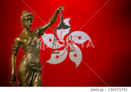 Lady Justice before a flag of Hong Kong 130255791