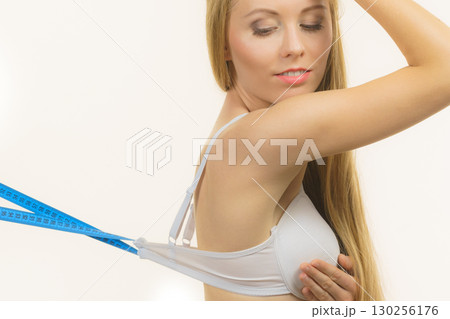 Woman wearing too big bra, loose band Woman wearing too big bra, loose band 130256176