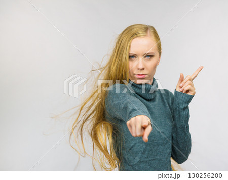 Woman pointing and shaking her finger Woman pointing and shaking her finger 130256200