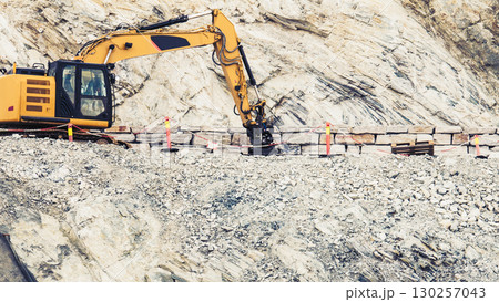Heavy machine working on construction site, Norway Heavy machine working on construction site, Norway 130257043