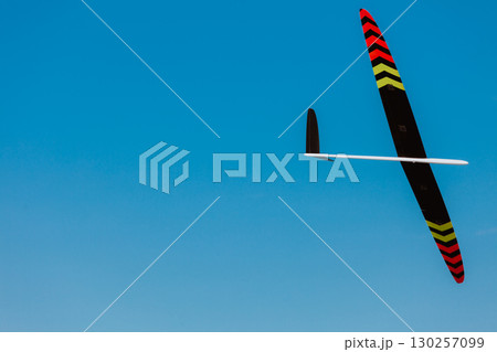 RC soaring plane on blue sky 130257099