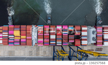 Aerial view container cargo ship at port with tugboat, Business global import export logistic maritime transport by container cargo ship vessel, International trade container cargo freight shipping. 130257568