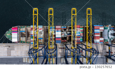 Aerial view container cargo ship at international port terminal with gantry crane, Global business import export logistic maritime transport by container cargo ship vessel, Container ship cargo Aerial view container cargo ship at international port terminal with gantry crane, Global business import export logistic maritime transport by container cargo ship vessel, Container ship cargo 130257652