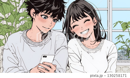 幸せそうに一緒にスマホを見る若いカップル
