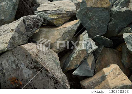 Explore the Beauty of Textured Natural Stones Showcasing a Variety of Colors and Unique Shapes Explore the Beauty of Textured Natural Stones Showcasing a Variety of Colors and Unique Shapes 130258898