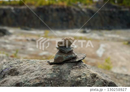 Beautifully Balanced Stone Tower Standing Tall Amidst the Wonders of Nature and Serenity 130258927