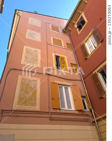 Old street in Italian countryside near sea. Traditional building. Sun day. Entrance, window to house. Nature and sky. Old street in Italian countryside near sea. Traditional building. Sun day. Entrance, window to house. Nature and sky. 130259063