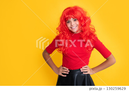 glad teen kid with red long hair on yellow background 130259629