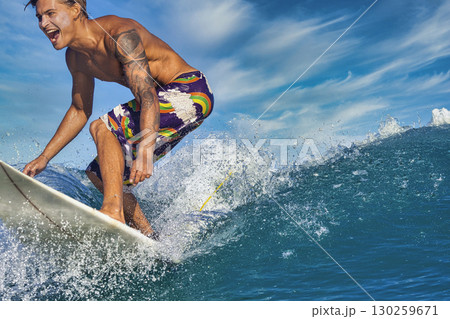 Male surfer on a blue wave Male surfer on a blue wave 130259671