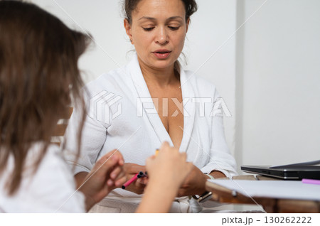 Mother and Daughter Engaged in Creative Activities at Home Mother and Daughter Engaged in Creative Activities at Home 130262222