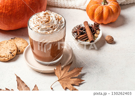 Autumn pumpkin spice coffee with pumpkins. Autumn pumpkin spice coffee with pumpkins. 130262403