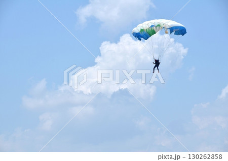 skydiver and blue sky with clouds skydiver and blue sky with clouds 130262858