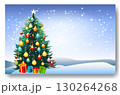 A beautifully decorated Christmas tree stands prominently against a snowy landscape 130264268