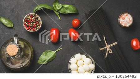 Black pasta with mozzarella cheese and fresh vegetables for italian cuisine 130264492