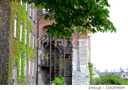 Beautiful Krakow market square. Faded colors. Vintage elegant carriages with beautifully dressed horses ride people around the historic center of Krakow on the old streets of Europe High quality photo Beautiful Krakow market square. Faded colors. Vintage elegant carriages with beautifully dressed horses ride people around the historic center of Krakow on the old streets of Europe High quality photo 130264664