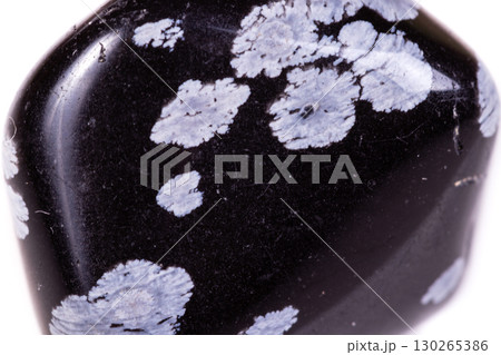 Macro mineral stone snow obsidian on white background Macro mineral stone snow obsidian on white background 130265386