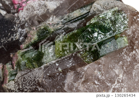 Macro mineral tourmaline stone in quartz on a white background 130265434