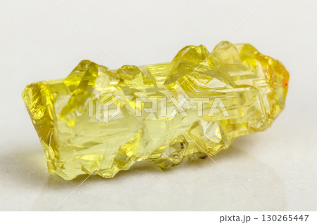 Macro mineral beryl heliodor stone on white background 130265447