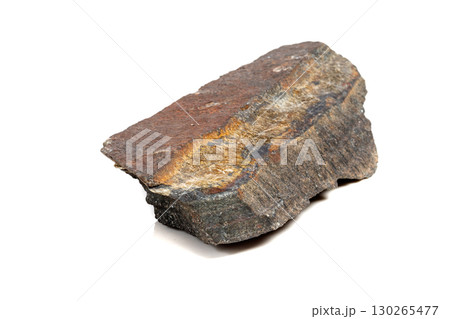 Macro mineral stone Snake eye in the rock a white background Macro mineral stone Snake eye in the rock a white background 130265477