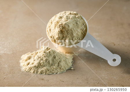 protein powder in scoop. dry mixture for preparation of sporting or dietary drink. protein powder in scoop. dry mixture for preparation of sporting or dietary drink. 130265950