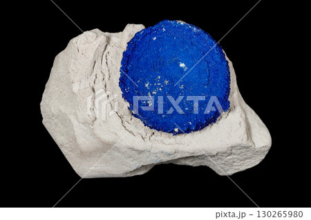 Macro mineral stone Azurite in siltstone against black background Macro mineral stone Azurite in siltstone against black background 130265980