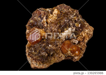 macro mineral stone Grossular, Garnet, Epidote on a black background macro mineral stone Grossular, Garnet, Epidote on a black background 130265986