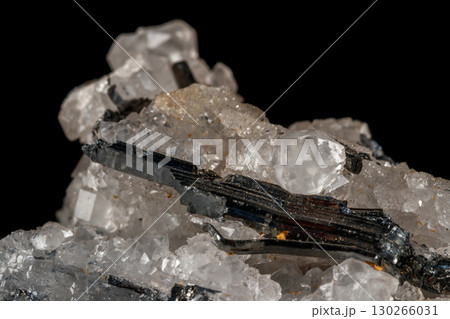 Macro mineral stone Stibnite quartz on a black background 130266031