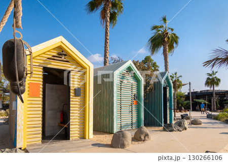 Bright colorful wooden houses on beach. Summer vacation at multicolored beach sheds huts. High quality photo Bright colorful wooden houses on beach. Summer vacation at multicolored beach sheds huts. High quality photo 130266106