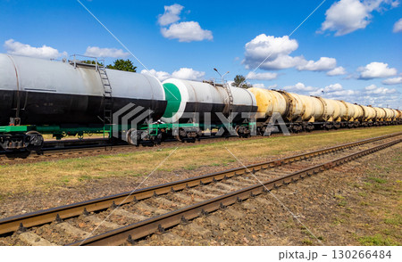 Railway tank cars used to transport petroleum products. . Identification markings have been removed. The fuel train with petrochemical tank cars. 130266484