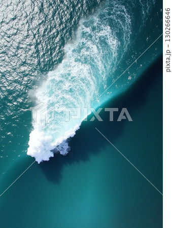Aerial view of a turquoise ocean wave cresting into white foam - ai generated 130266646