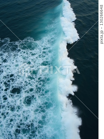 Aerial view of a turquoise ocean wave cresting into white foam - ai generated 130266648