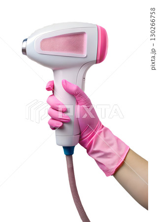 Pink laser hair removal device held by gloved hand, dermatology tool isolated on transparent background 130266758