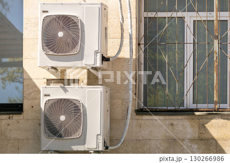 air conditioners are mounted on the wall. technologies for air cooling in hot weather. air conditioners are mounted on the wall. technologies for air cooling in hot weather. 130266986