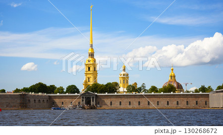 Peter and Paul Cathedral and fortress in Saint Petersburg, Russia. Scenery of historical landmark of city with Neva river and blue sky 130268672