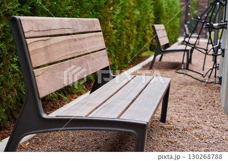 Modern Outdoor Benches Placed Comfortably Amidst Lush Greenery and Beautiful Landscapes Modern Outdoor Benches Placed Comfortably Amidst Lush Greenery and Beautiful Landscapes 130268788