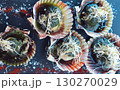 Delicious grilled scallops in shells, fresh seafood with a sause and soy sprouts. 130270029