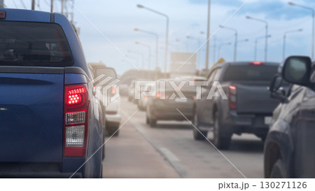 Close up on trail light of pickup car blue color. Many cars are parked in a row. Common sense on city roads during rush hour in Thailand. 130271126