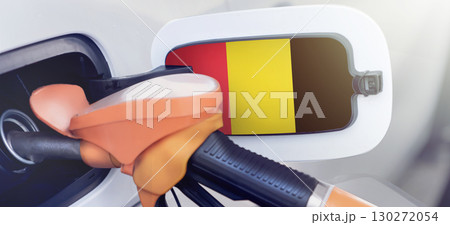 The flag of Belgium on the hatch of the gas tank of a car at a gas station. Gasoline and diesel fuel in Belgia. High prices for diesel fuel, gasoline and gas at gas stations in Belgium. Problems with 130272054