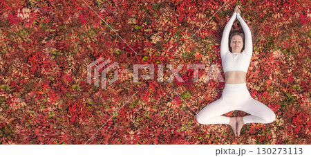 Woman practicing yoga in a serene autumn setting surrounded by vibrant leaves. A woman is engaged in health and fitness on a carpet of red leaves autumn flat lay Woman practicing yoga in a serene autumn setting surrounded by vibrant leaves. A woman is engaged in health and fitness on a carpet of red leaves autumn flat lay 130273113